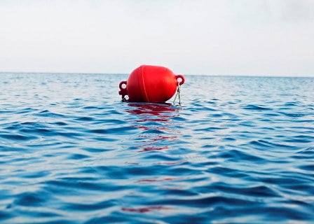 Red Buoy And Sea